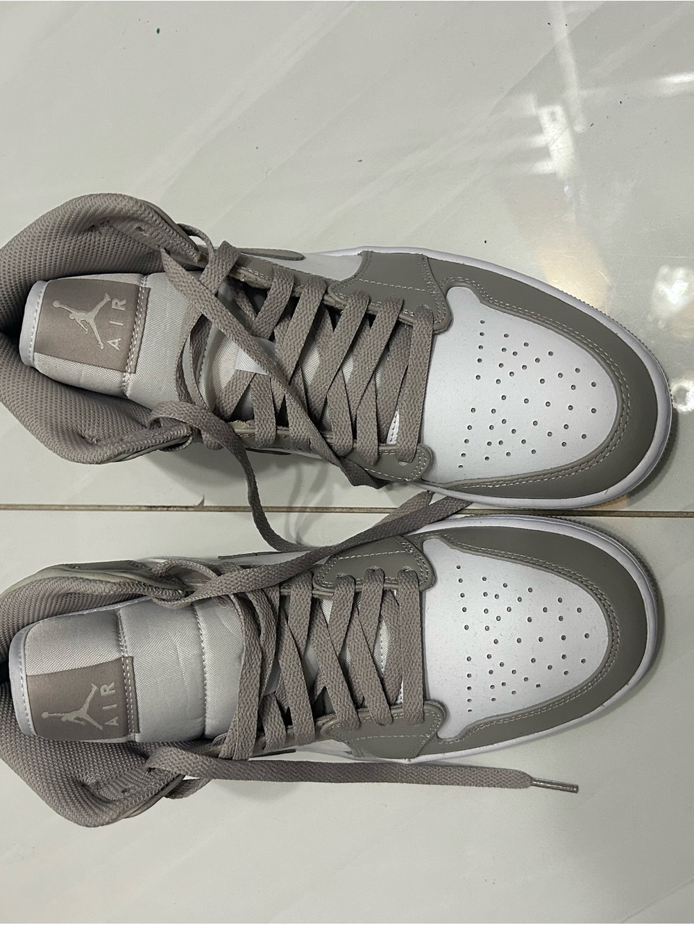 Jordan 1s Mid Sneakers in White and Gray size 8